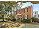 Charming brick home with black shutters, an inviting front porch, and well-manicured landscaping at 51 Gadsden St # B, Charleston, SC 29401