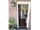 View of a modern kitchen through an exterior doorway, featuring stainless steel appliances at 51 Gadsden St # B, Charleston, SC 29401