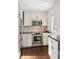 Bright kitchen showcases stainless steel oven, microwave, and a tiled backsplash at 51 Gadsden St # B, Charleston, SC 29401