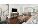 Open living space with hardwood floors, connecting living room to kitchen area at 51 Gadsden St # B, Charleston, SC 29401