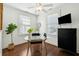 Bright and airy office with a glass desk, modern decor, and two large windows at 51 Gadsden St # B, Charleston, SC 29401