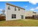 Backyard with sliding glass door to home's interior and a wood fence offering privacy at 558 Wynfield Forest Dr, Summerville, SC 29485