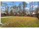 Backyard featuring a lawn and wood fence, ideal for outdoor activities and relaxation at 558 Wynfield Forest Dr, Summerville, SC 29485