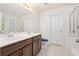 Modern bathroom featuring a double sink vanity, walk-in shower, and sleek fixtures at 558 Wynfield Forest Dr, Summerville, SC 29485