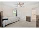 Cozy bedroom featuring plush carpet, ceiling fan and natural light from the window at 558 Wynfield Forest Dr, Summerville, SC 29485