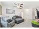 Relaxing bonus room featuring a plush sofa, ceiling fan and a serene atmosphere at 558 Wynfield Forest Dr, Summerville, SC 29485