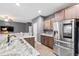 Kitchen with stainless steel refrigerator, granite countertops and breakfast bar at 558 Wynfield Forest Dr, Summerville, SC 29485
