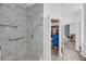 Bright bathroom features a modern tiled shower, accessible grab bar, and ensuite closet at 60 Fenwick Hall Allee # 314, Johns Island, SC 29455