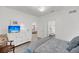 Bright primary bedroom with dresser and television, showing an ensuite bathroom and living room at 60 Fenwick Hall Allee # 314, Johns Island, SC 29455