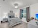 Calming bedroom features a queen bed, bedside table, and lots of natural light at 60 Fenwick Hall Allee # 314, Johns Island, SC 29455