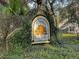 Ivy-covered sign for Twelve Oaks neighborhood in a tranquil, natural setting at 60 Fenwick Hall Allee # 314, Johns Island, SC 29455
