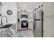 Stylish kitchen boasts stainless steel appliances, granite counters, and custom cabinetry at 60 Fenwick Hall Allee # 314, Johns Island, SC 29455