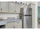 A well-equipped kitchen with granite countertops, stainless steel fridge, and ample cabinet space at 60 Fenwick Hall Allee # 314, Johns Island, SC 29455
