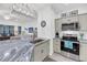 Modern kitchen featuring an island with granite countertops, stainless steel appliances, and an open floor plan at 60 Fenwick Hall Allee # 314, Johns Island, SC 29455