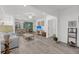 Open-concept living area with white walls, wooden floors, and modern furnishings at 60 Fenwick Hall Allee # 314, Johns Island, SC 29455