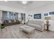 Bright living room features modern decor, gray and white sofas, and light gray flooring at 60 Fenwick Hall Allee # 314, Johns Island, SC 29455