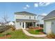View of the home's backyard and outbuilding, showing a well-maintained lawn and outdoor living space at 643 Blueway Ave, Summerville, SC 29486