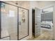 Modern bathroom featuring a glass-enclosed shower, tiled walls, and views into the bedroom through the doorway at 643 Blueway Ave, Summerville, SC 29486