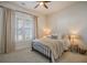 Cozy bedroom featuring a metal-framed bed, neutral decor, and natural light from the window at 643 Blueway Ave, Summerville, SC 29486