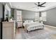 Relaxing main bedroom with gray walls, a ceiling fan, and natural light from two windows at 643 Blueway Ave, Summerville, SC 29486