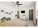 Bright bedroom with a ceiling fan, TV, dresser, and plush decor, creating a cozy and inviting space at 643 Blueway Ave, Summerville, SC 29486