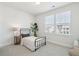 Well-lit secondary bedroom with a window view and comfortable furnishings at 643 Blueway Ave, Summerville, SC 29486