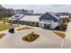 Aerial shot of community clubhouse, showcasing the manicured landscaping and paved entrance at 643 Blueway Ave, Summerville, SC 29486