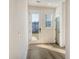 Bright foyer with a glass-paneled front door, side window, and stylish flooring that enhances its inviting appeal at 643 Blueway Ave, Summerville, SC 29486