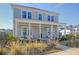 Charming two-story home with a welcoming front porch and well-manicured landscaping at 643 Blueway Ave, Summerville, SC 29486