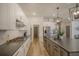 Modern kitchen with stainless steel appliances, a large island, and ample counter space at 643 Blueway Ave, Summerville, SC 29486