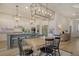Open-concept kitchen and dining area featuring stylish lighting and modern design elements at 643 Blueway Ave, Summerville, SC 29486