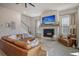 Inviting living room with fireplace, mantel-mounted TV, comfortable seating, and views of the staircase at 643 Blueway Ave, Summerville, SC 29486