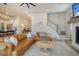 Open-concept living area featuring modern decor, hardwood flooring, and seamlessly connected to dining and kitchen spaces at 643 Blueway Ave, Summerville, SC 29486