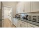 Well-organized butler's pantry with extensive cabinet storage and a sleek countertop at 643 Blueway Ave, Summerville, SC 29486