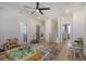 Spacious playroom with hardwood floors, ceiling fan, and abundant natural light at 643 Blueway Ave, Summerville, SC 29486