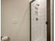 Modern shower with sleek glass door, white tiled walls, niches, and mosaic tile floor at 643 Blueway Ave, Summerville, SC 29486