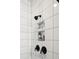 Modern shower with sleek black hardware, recessed storage, and tiled walls at 643 Blueway Ave, Summerville, SC 29486