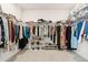 Spacious walk-in closet with ample storage and organization for clothes and shoes at 643 Blueway Ave, Summerville, SC 29486