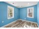 Bright bedroom featuring stylish flooring, windows, and modern finishes at 716 W 3Rd N St, Summerville, SC 29483