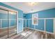 Bright bedroom featuring a window and a closet with mirrored doors at 716 W 3Rd N St, Summerville, SC 29483