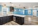 Bright kitchen featuring stainless steel appliances, modern countertops, and an open design to the living room at 716 W 3Rd N St, Summerville, SC 29483