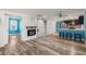 Open-concept living area with fireplace, stylish flooring, breakfast bar and modern finishes at 716 W 3Rd N St, Summerville, SC 29483