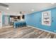 Open-concept living area with stainless steel appliances, breakfast bar and modern flooring at 716 W 3Rd N St, Summerville, SC 29483