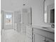 Bright bathroom with dual sinks, marble floors, modern fixtures, and access to shower and tub at 747 Maynard Ln, Summerville, SC 29486