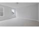 This bedroom has plush neutral carpet, large windows, and neutral paint at 747 Maynard Ln, Summerville, SC 29486