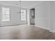 Open dining area with gray floors, neutral walls, and modern light fixture at 747 Maynard Ln, Summerville, SC 29486