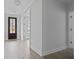 Bright entryway featuring light gray plank floors and a dark stained front door at 747 Maynard Ln, Summerville, SC 29486