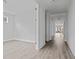 Hallway showcasing gray plank floors and bright neutral paint throughout the house at 747 Maynard Ln, Summerville, SC 29486