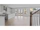 Bright kitchen with stainless appliances, island, and access to backyard with beautiful white cabinets at 747 Maynard Ln, Summerville, SC 29486