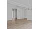 Open-concept living area with light gray plank flooring and neutral paint at 747 Maynard Ln, Summerville, SC 29486